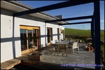 A vendre par TAIC Immobilier agence immobilière en ligne secteur Albi / Gaillac Villa d'architecte plain-pied sur 160m2 et 3000m2 de terrain en situation dominante.
