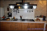 A vendre par TAIC Immobilier à Castres Grande longère de 1000m2 sur 8900m2 de terrain comprenant partie privative, 7 studios et dépendances,puit,lavoir.