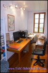 A vendre par TAIC Immobilier à Castres Grande longère de 1000m2 sur 8900m2 de terrain comprenant partie privative, 7 studios et dépendances,puit,lavoir.