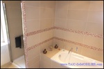 A vendre par TAIC Immobilier à Castres Grande longère de 1000m2 sur 8900m2 de terrain comprenant partie privative, 7 studios et dépendances,puit,lavoir.