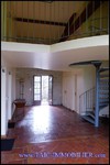 A vendre par TAIC Immobilier à Castres Grande longère de 1000m2 sur 8900m2 de terrain comprenant partie privative, 7 studios et dépendances,puit,lavoir.