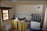 A vendre par TAIC Immobilier à Castres Grande longère de 1000m2 sur 8900m2 de terrain comprenant partie privative, 7 studios et dépendances,puit,lavoir.