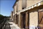 A vendre par Taic Immobilier : Cordes sur Ciel ancien corps de ferme sur 6 hectares et ses dépendances, vue sur Cordes, puits